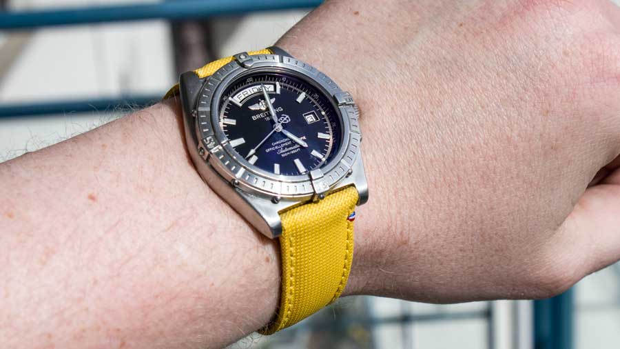 The avel yello canvas strap on a Brietling Headwind